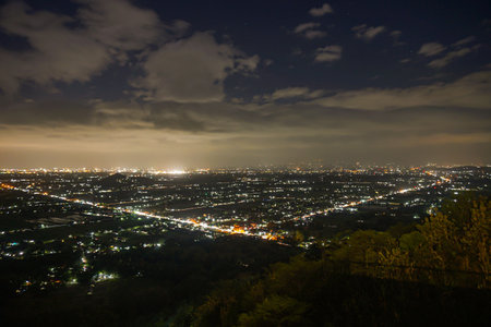 Yogyakarta city at night is filled with beautiful looking light from the hill of wonosari star.の写真素材