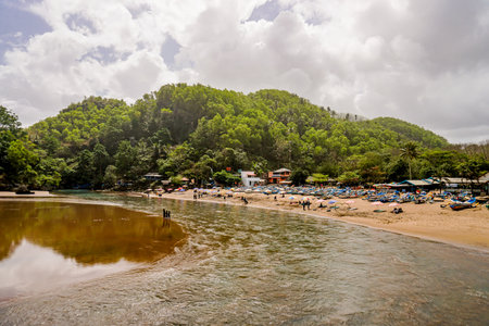 Baron beach is filled with fishing boats parked in the dunes and visitors who enjoy the atmosphere of the beach.の写真素材