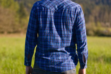 The torso of a man photographed from the back.の写真素材