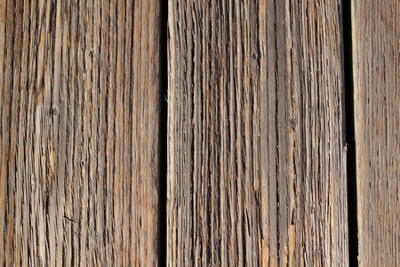 Wood boards are photographed at a dock to create some individual abstract images of the texture of wood after being weathered for many years.の写真素材