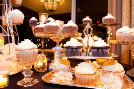 A dessert display of cupcakes at a wedding reception の写真素材