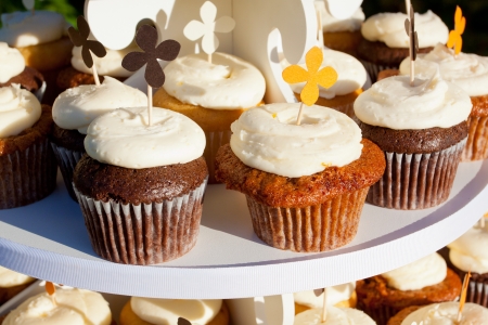 Wedding cupcakes of chocolate, vanilla, and carrotcake at a wedding reception の写真素材