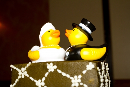 Rubber ducks are the cake toppers for this wedding cake at a very non-traditional reception for the bride and groom.の写真素材