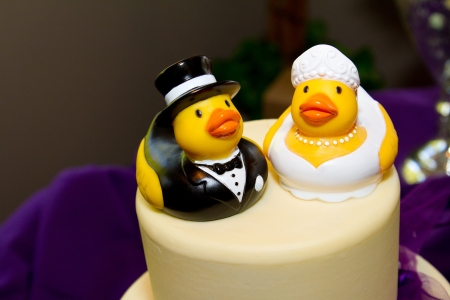 Rubber ducks are the cake toppers for this wedding cake at a very non-traditional reception for the bride and groom.の写真素材