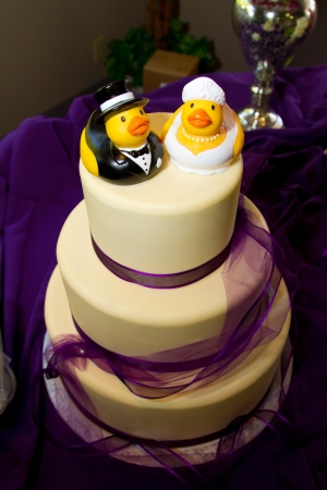 Rubber ducks are the cake toppers for this wedding cake at a very non-traditional reception for the bride and groom.の写真素材