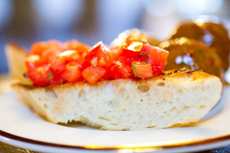 Tomato bruschetta covers this hearty bread as an appetizer at a wedding reception の写真素材