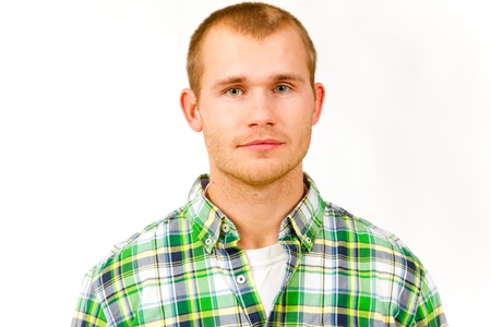 A fashion portrait of a guy in the studio against a white isolated background.の写真素材
