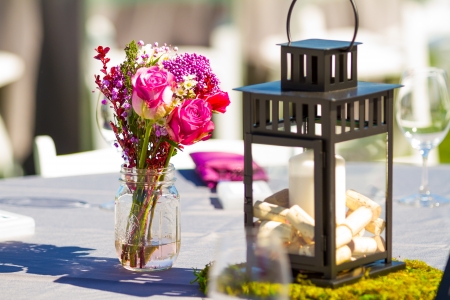 Tables, chairs, decor, and decorations at a wedding reception at an outdoor venue vineyard winery in oregon.の写真素材