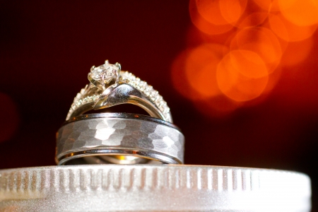 Wedding rings are placed on a mason jar during the reception to create this night feel ring image in color.の写真素材
