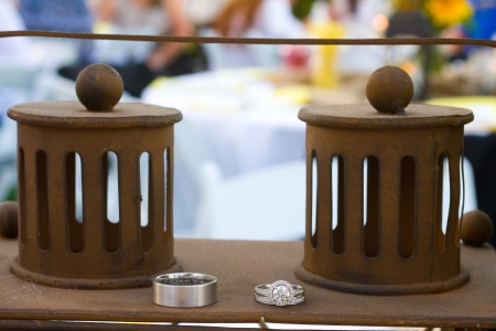 Wedding rings are placed on the center pieces of this classy wedding reception.の写真素材