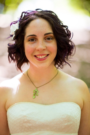 A beautiful bride poses for a portrait in color on her wedding day in Oregon.の写真素材