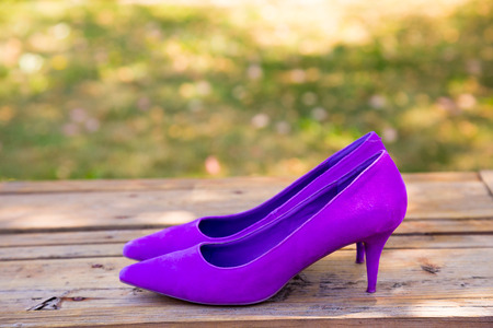 Bridal shoes for the wedding in purple before the bride has put them on her feet on the wedding day.の写真素材