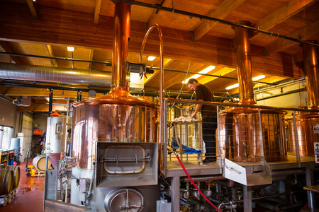 Bend, OR, USA - January 12, 2014: Beer making inside of the Crux Fermentation Project with large fermenters and industrial equipment.のeditorial素材
