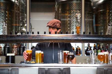 Bend, OR, USA - January 12, 2014: Bartender pouring drinks at Crux Fermentation Project in Bend, Oregon.のeditorial素材