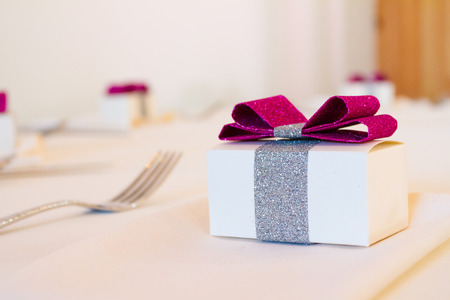 Party favor presents at a wedding reception on the table.の写真素材