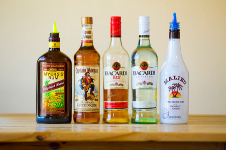 Eugene, OR, USA - June 23, 2014: Rum selection at a bar showing five kinds of hard liquor.のeditorial素材