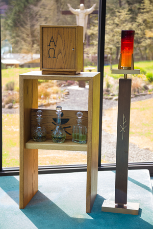 Wedding altar for a Catholic religion ceremony with holy oil for annointing the bride and groom.