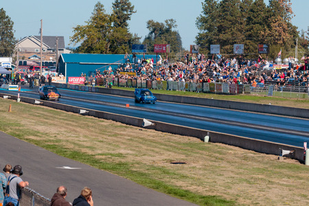 WOODBURN, OR - SEPTEMBER 27, 2015: Zuess vs Hell On Wheels in the funny car division at the NHRA 30th Annual Fall Classic at the Woodburn Dragstrip.のeditorial素材