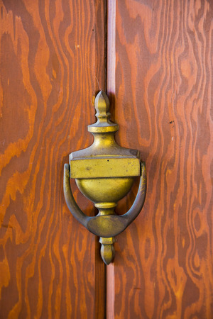 Brass knocker on an antique door at a winery in Southern Oregon.