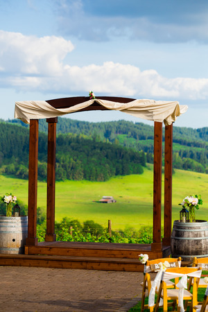 Wedding venue in Western Oregon at a winery with outdoor seating overlooking the vineyard.の写真素材