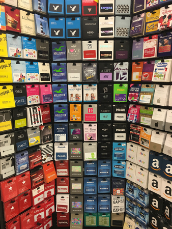 SPRINGFIELD, OR - OCTOBER 22, 2015: Gift cards for various companies on the endcap at a grocery...
