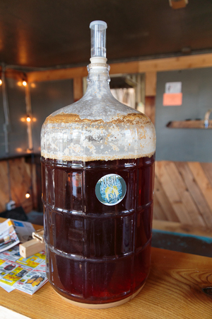 EUGENE, OR - NOVEMBER 4, 2015: Five gallon homebrew beer fermenting at the startup craft brewery...