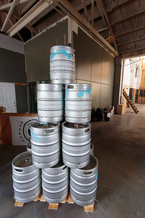 EUGENE, OR - NOVEMBER 4, 2015: Stainless steel beer kegs stacked together at the startup craft brewery Mancave Brewing.のeditorial素材