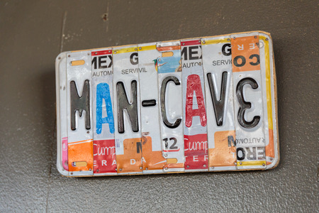 EUGENE, OR - NOVEMBER 4, 2015: License plate logo sign at the startup craft brewery Mancave Brewing.