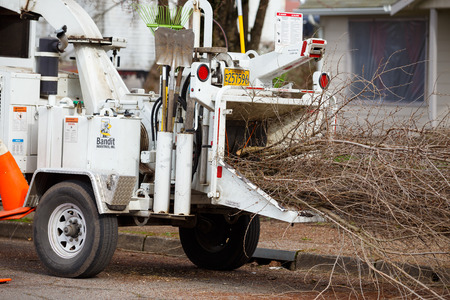 SPRINGFIELD, OR - FEBRUARY 16, 2016: Wood chipper trailer attached to the back of a utility work...