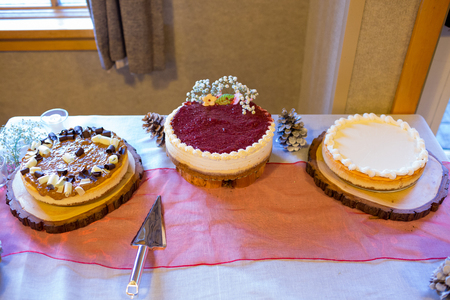 Cheesecake at a wedding reception in the winter offers a cozy warm vibe for the bride and groom.の写真素材