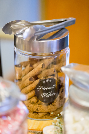 Pirouette wafers at a coffee and dessert bar with hot chocolate at a winter wedding reception.の写真素材