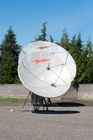 EUGENE, OR - MARCH 31, 2017: Communcations dish for cable television at a media facility that has been abandoned.のeditorial素材