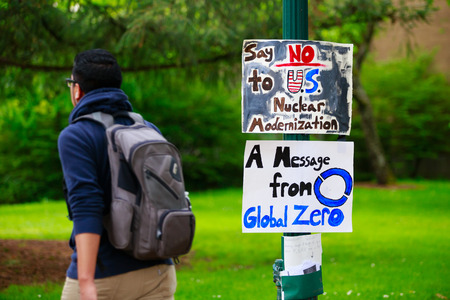 EUGENE, OR - MAY 9, 2015: Protest sign says no to U.S. nuclear modernization, a message from Global Zero group on the University of Oregon campus in Eugene.のeditorial素材