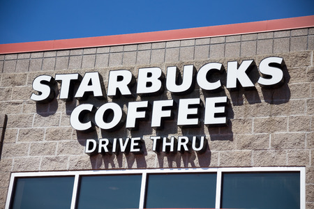 SPRINGFIELD, OR - MARCH 31, 2017: Starbucks drive thru coffee shop storefront in Springfield Oregon next to the Gateway Mall and Interstate 5.のeditorial素材