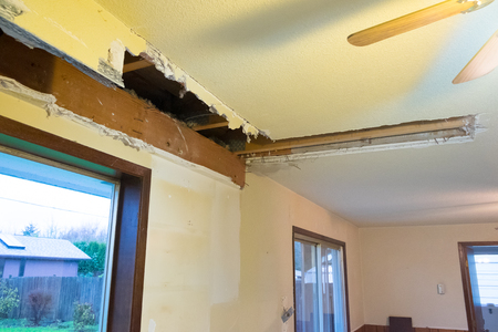 Major mess from a soffit demo during a home renovation and remodel in a residential house.の写真素材