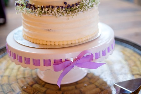 White Wedding Cake with Ribbonの写真素材