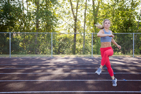 Young Female Athlete Working Out on Track