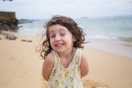 Child Playing on Beach in Oahu Hawaiiの写真素材