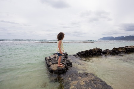 Child Playing on Beach in Oahu Hawaiiの写真素材