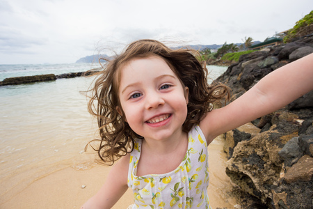 Child Playing on Beach in Oahu Hawaiiの写真素材