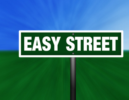A green and white street sign with の写真素材