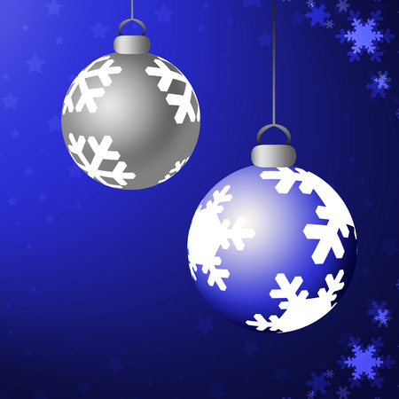Shiny blue and silver christmas ornaments against blue background with star and snowflake trim.の写真素材