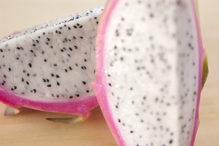 This is a cutted dragon fruit on a cutting board.の写真素材