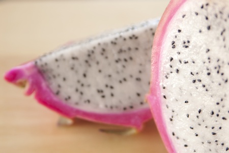 This is a cutted dragon fruit on a cutting board.の写真素材