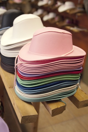 This is some stacks of colorful cowboy hats for kid in a store of the western festival of St-Tite.の写真素材