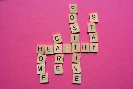 Positive, Stay, Healthy, Care, Home, crossword isolated on pink backgroundの写真素材