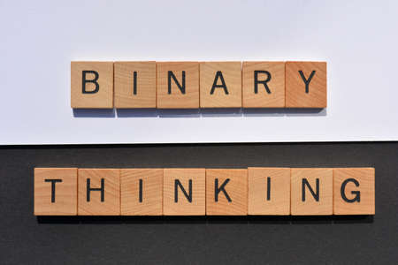 Binary Thinking, words in wooden alphabet letters on black and white backgroundの写真素材