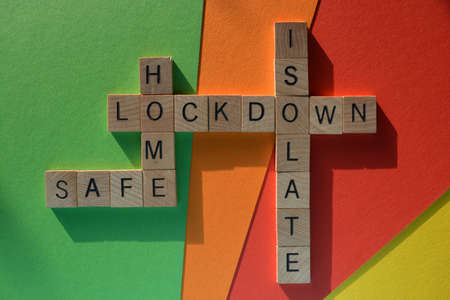 Lockdown, Safe, Home, Isolate, words in wooden alphabet letters in crossword form, isolated on...