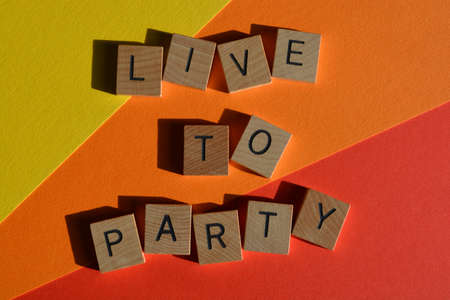 Live to Party,words in wooden alphabet letters isolated on colourful background,の写真素材