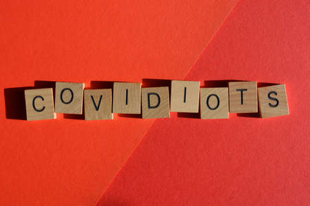 Covidiots, Covid and Idiots, a word which trends on social media, refers to people who do not wear masks or social distance.の写真素材